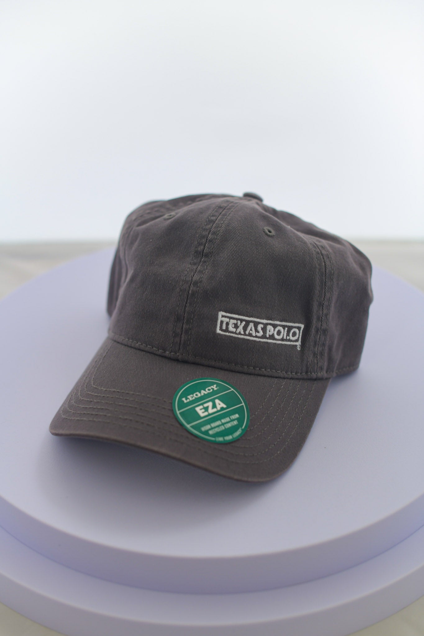 Grey hat with small white Texas Polo logo.