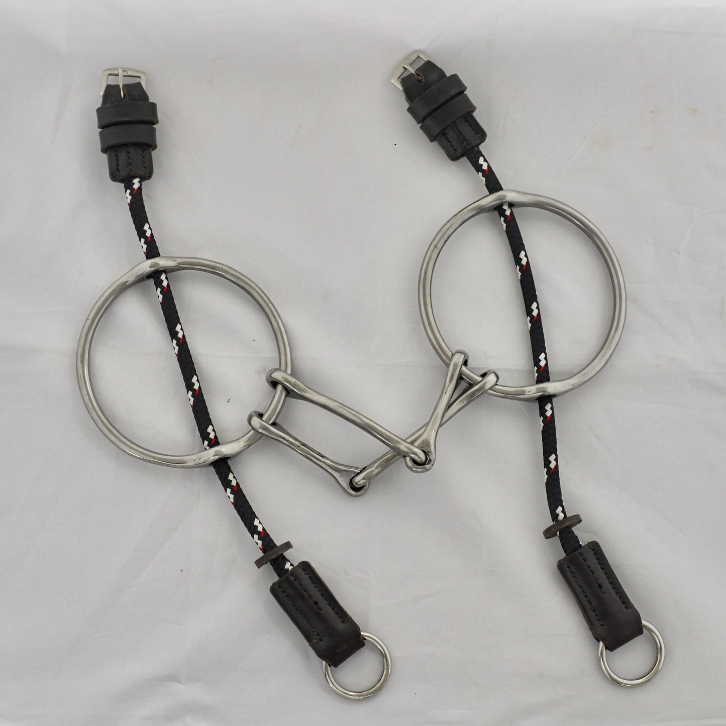 5 inch ring gag horse bit on a white surface.