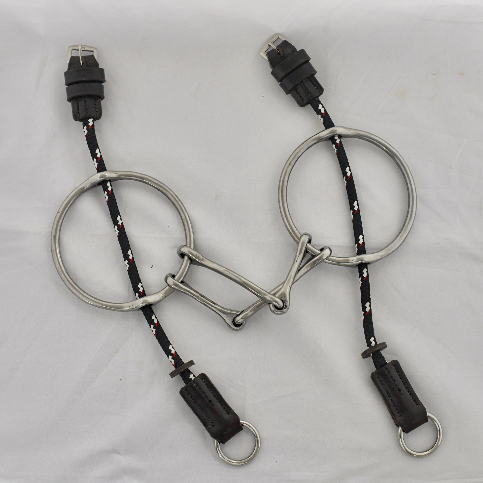 5 inch ring gag horse bit on a white surface.