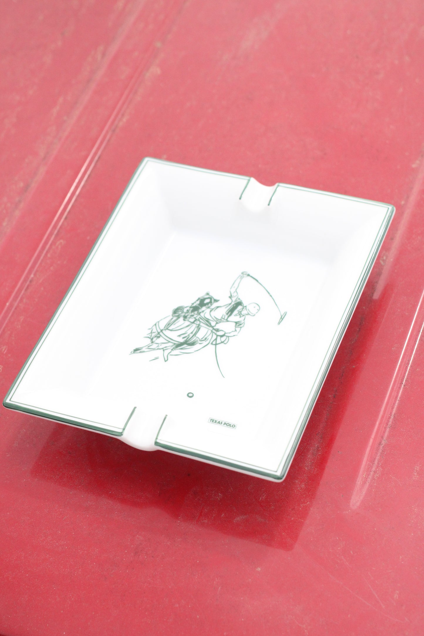 Top view of ash tray with Texas Polo logo and polo player graphic.