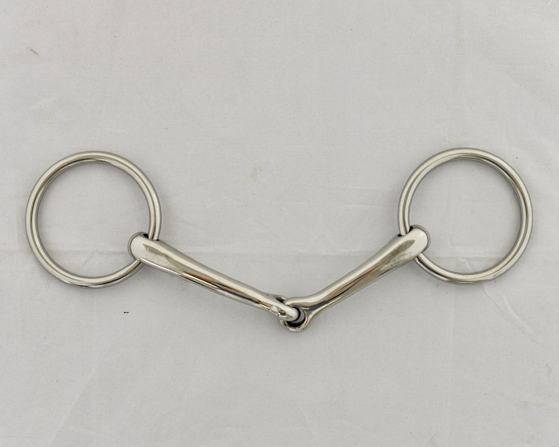 Badroon gag horse bit on a white surface.