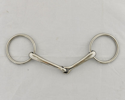 Badroon gag horse bit on a white surface.