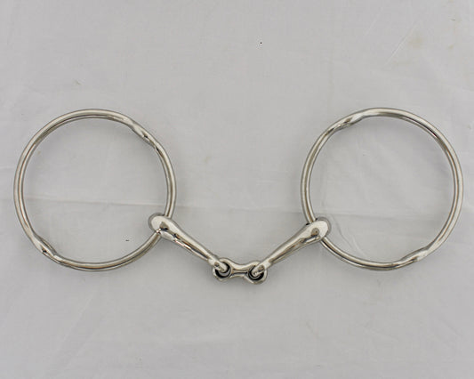 Center link gag horse bit on a white surface.