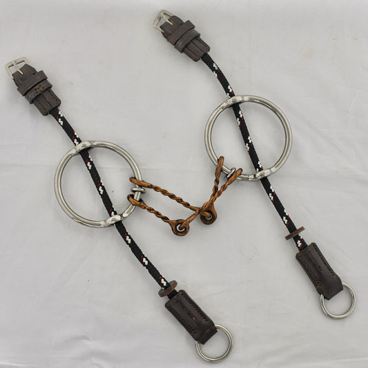 Copper twist barry gag horse bit on a white surface.