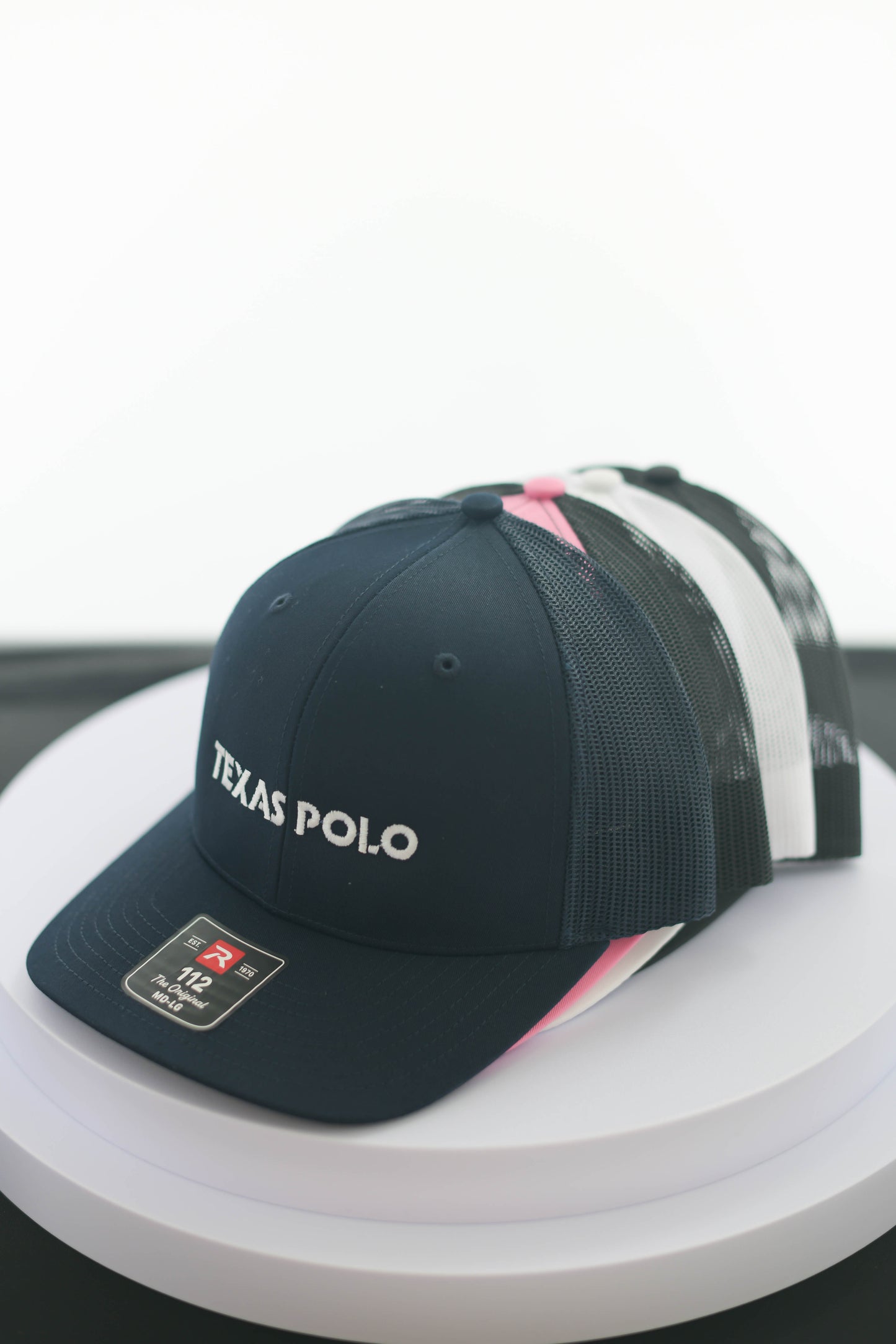 Stack of Texas Polo caps.