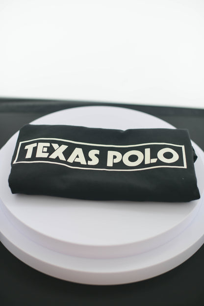 Folded black Texas Polo tshirt.