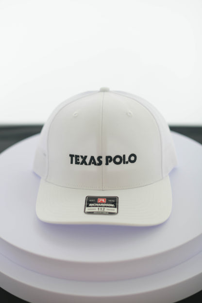 White Texas Polo cap on a white surface.