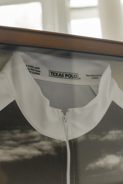 Close-up of framed jersey, showing the Texas Polo logo on the inside of the collar.
