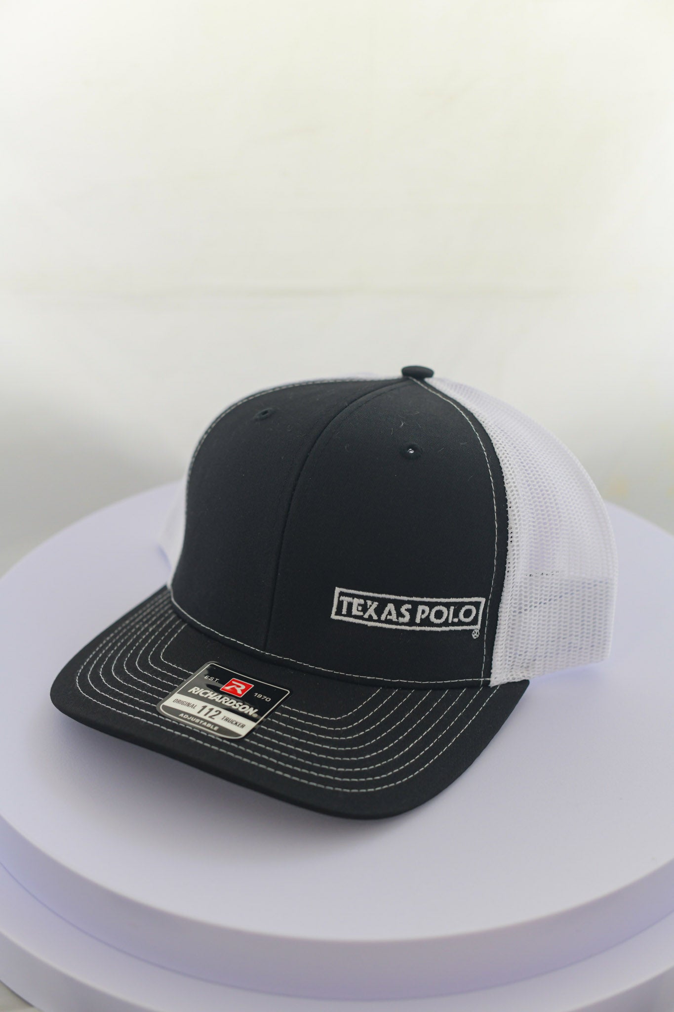 Black and white mesh back cap with small white Texas Polo logo.