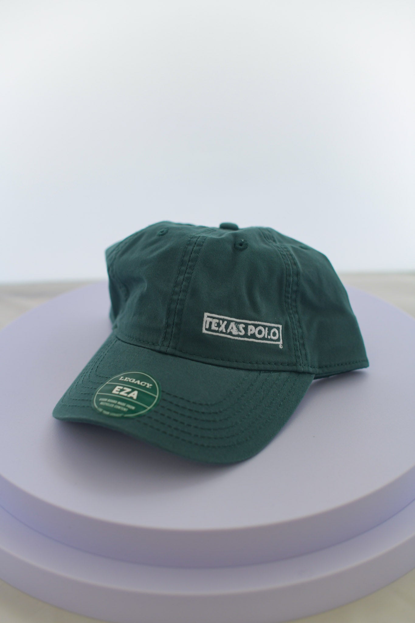 Dark green hat with small white Texas Polo logo.