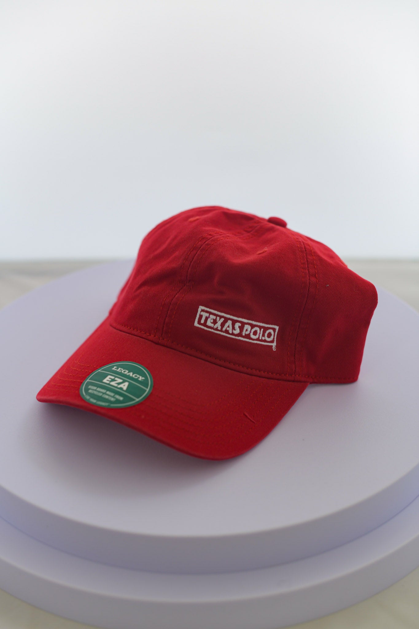 Red hat with small white Texas Polo logo.