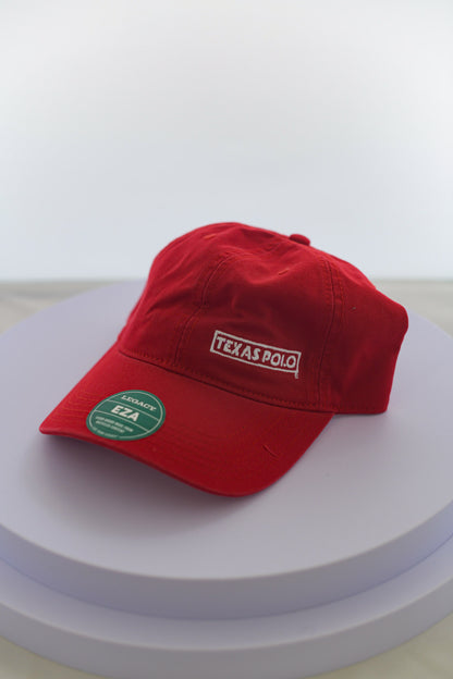 Red hat with small white Texas Polo logo.