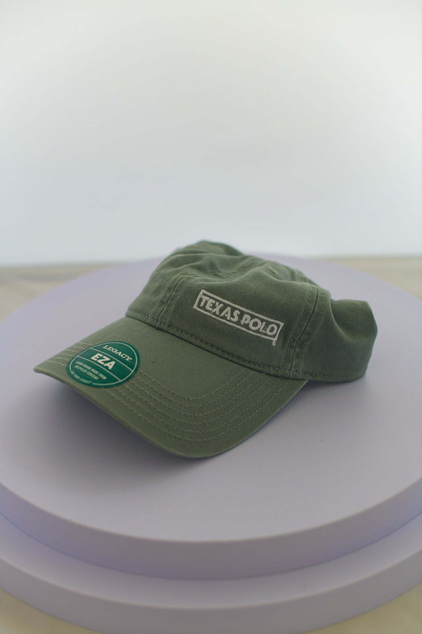 Light green hat with small white Texas Polo logo.