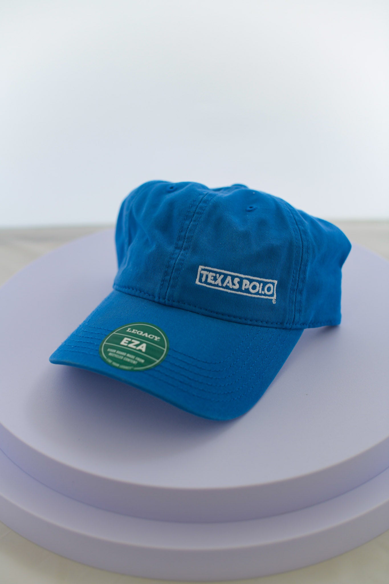 Blue hat with small white Texas Polo logo.