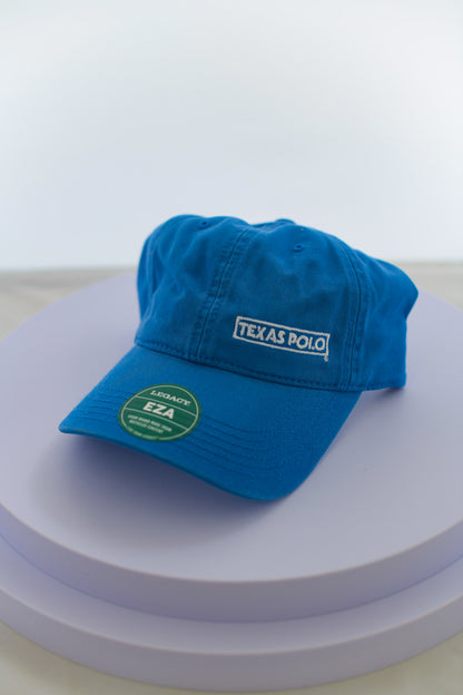 Blue hat with small white Texas Polo logo.