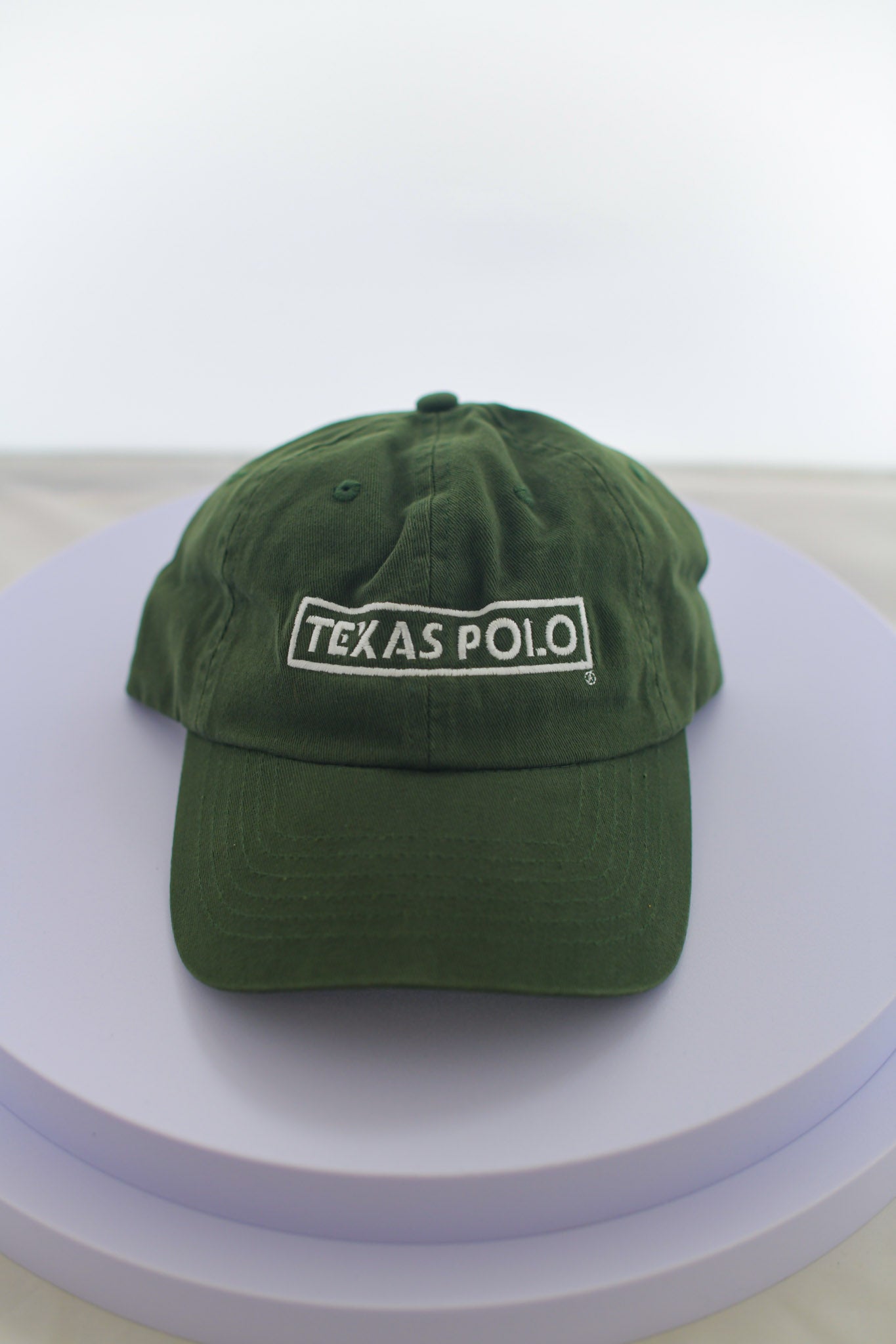 Army green hat with large white Texas Polo logo.
