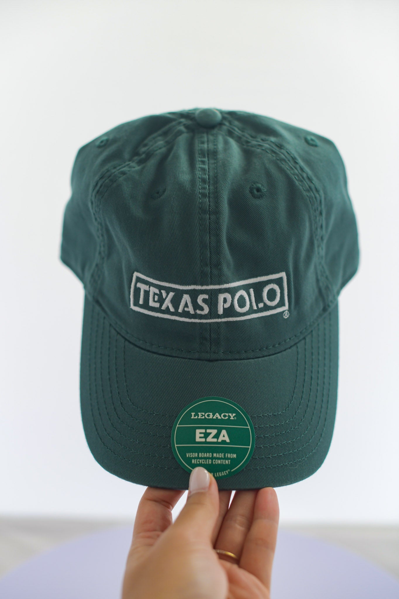 Dark green hat with large white Texas Polo logo.