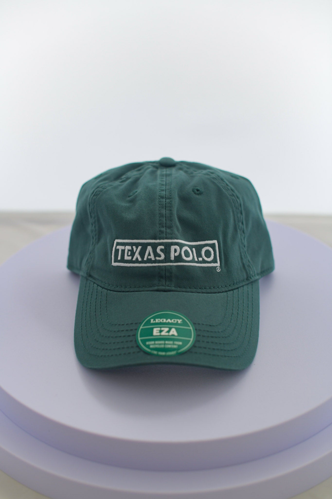 Dark green hat with large white Texas Polo logo.