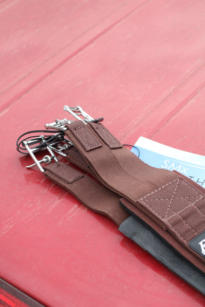 Closeup of buckles on overgirth.