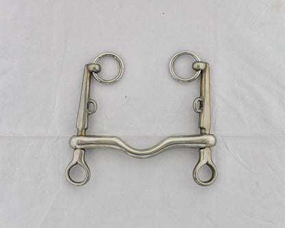 Pelham horse bit on a white surface.