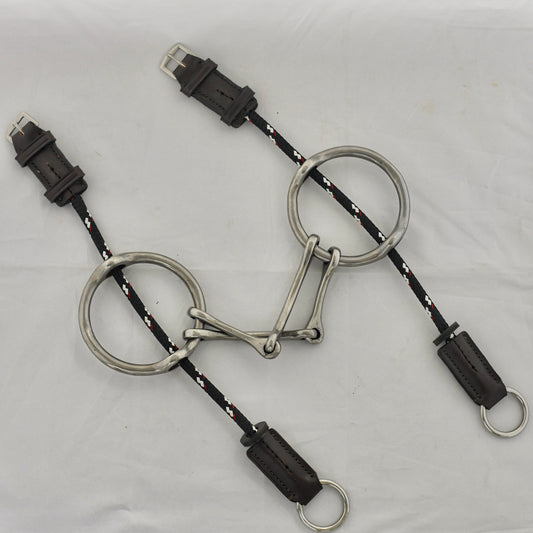Plain barry gag horse bit on a white surface.