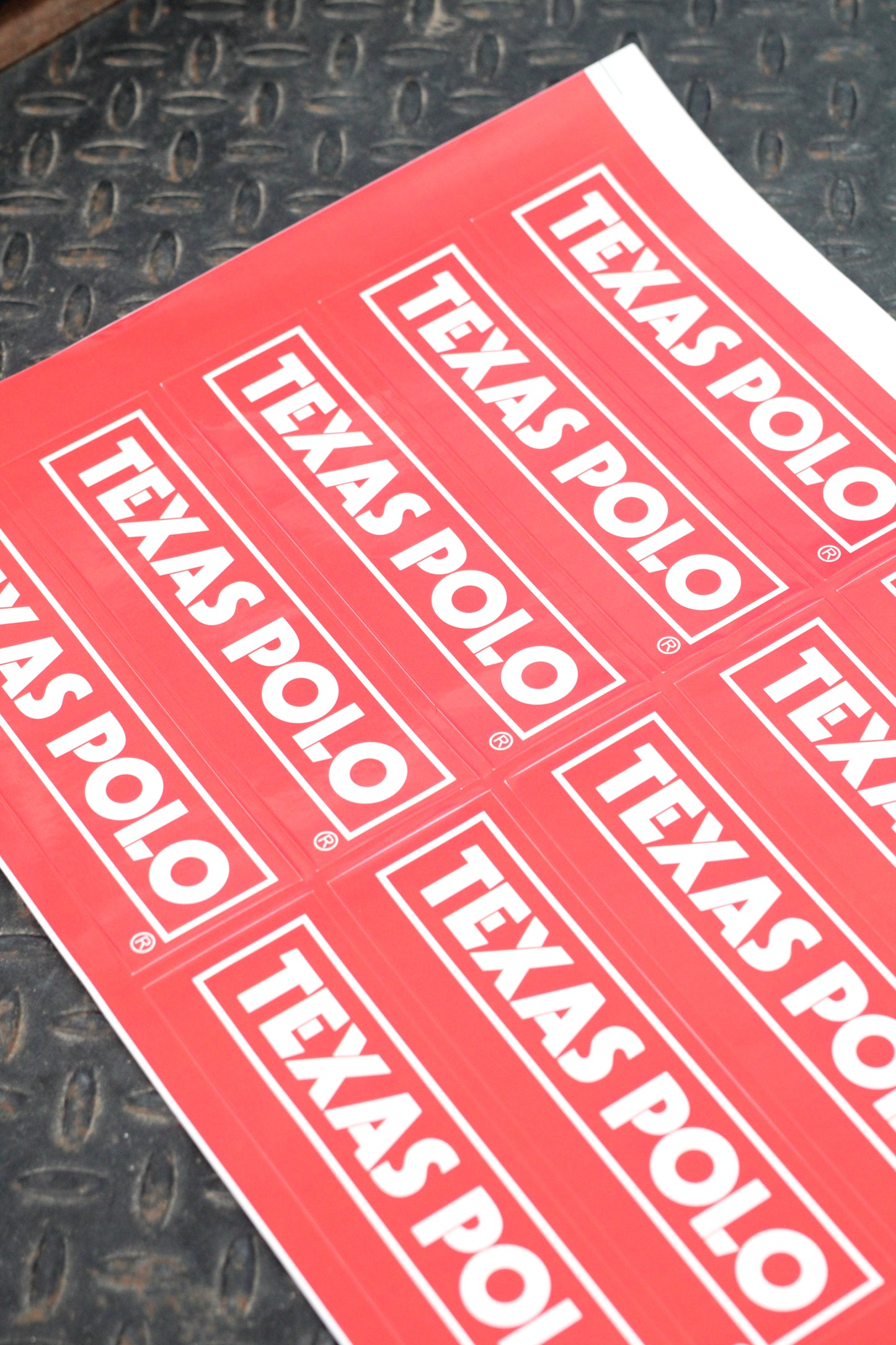Sheet of red stickers with white Texas Polo logo.