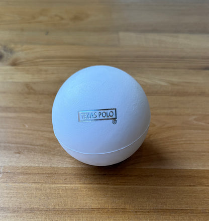 White polo ball with Texas Polo logo.