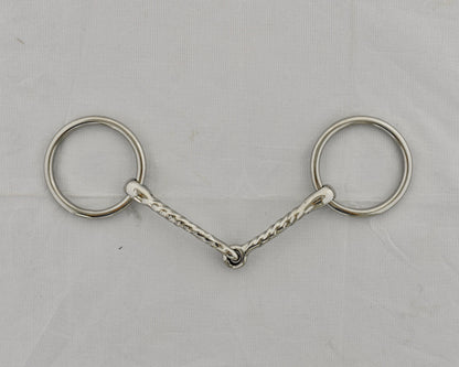 Twisted badroon gag horse bit on a white surface.