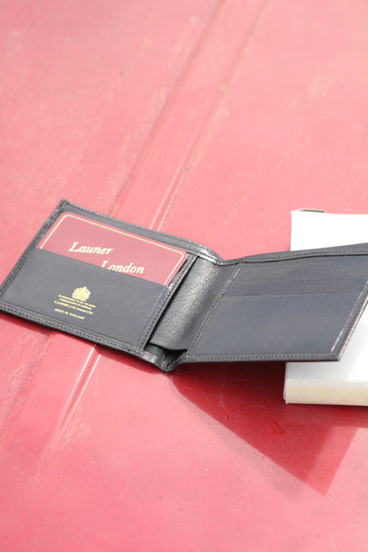 Leather bifold wallet opened face up.